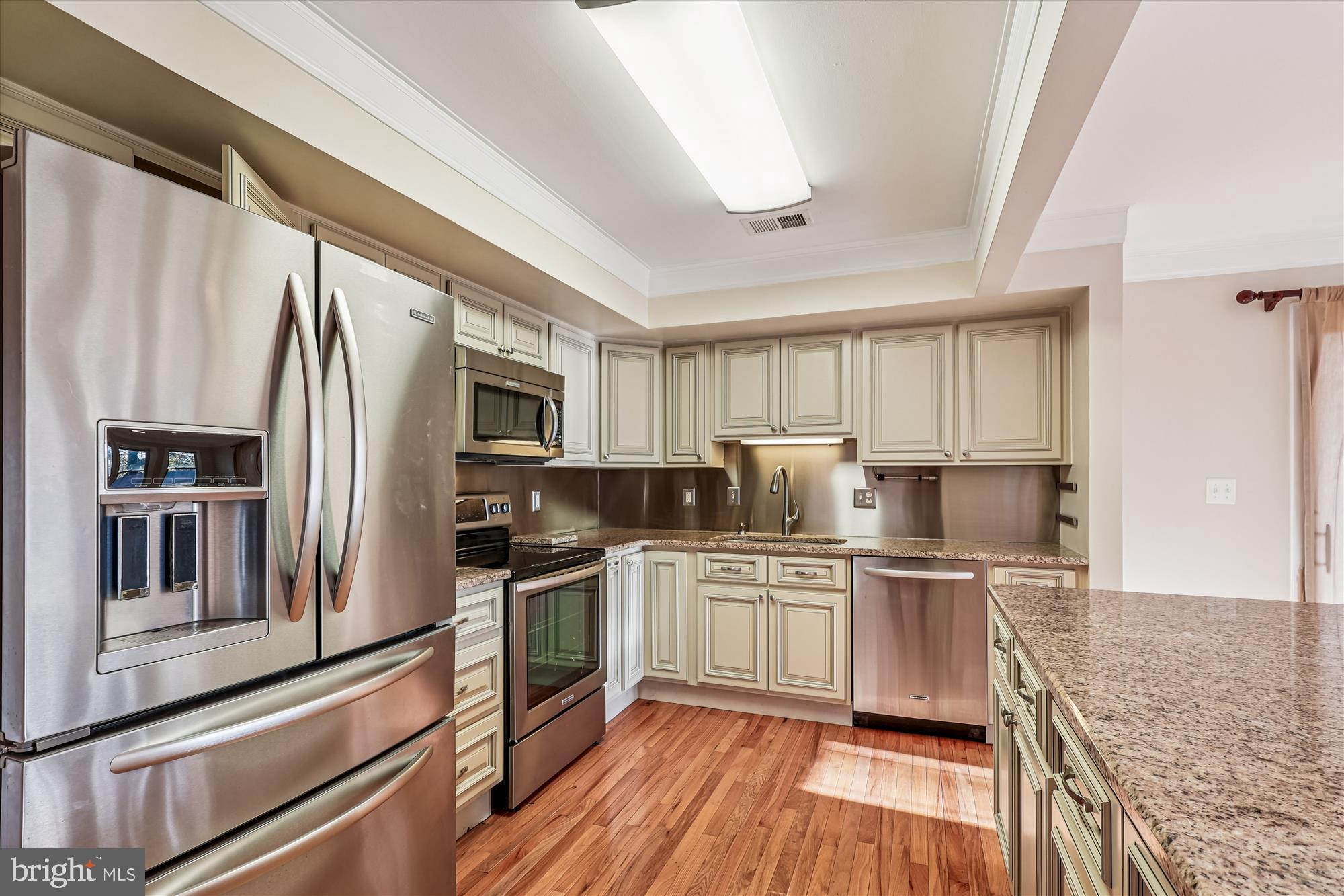 1506 Widows Mite Road Edgewater, MD 21037 - Photo 35 of 66 a kitchen with stainless steel appliances granite countertop a refrigerator stove and sink