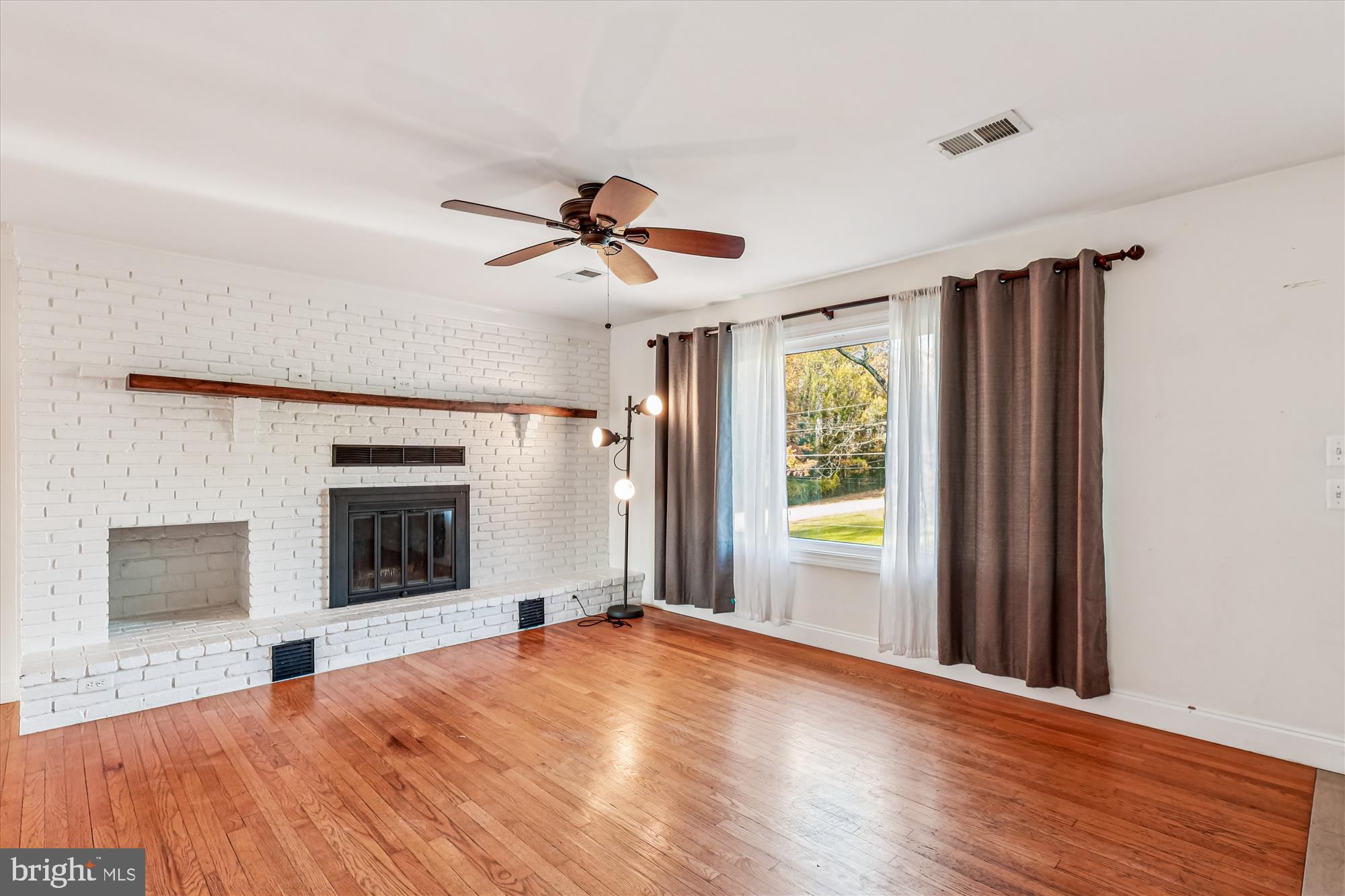 1506 Widows Mite Road Edgewater, MD 21037 - Photo 43 of 66 a bedroom with a bed and a window