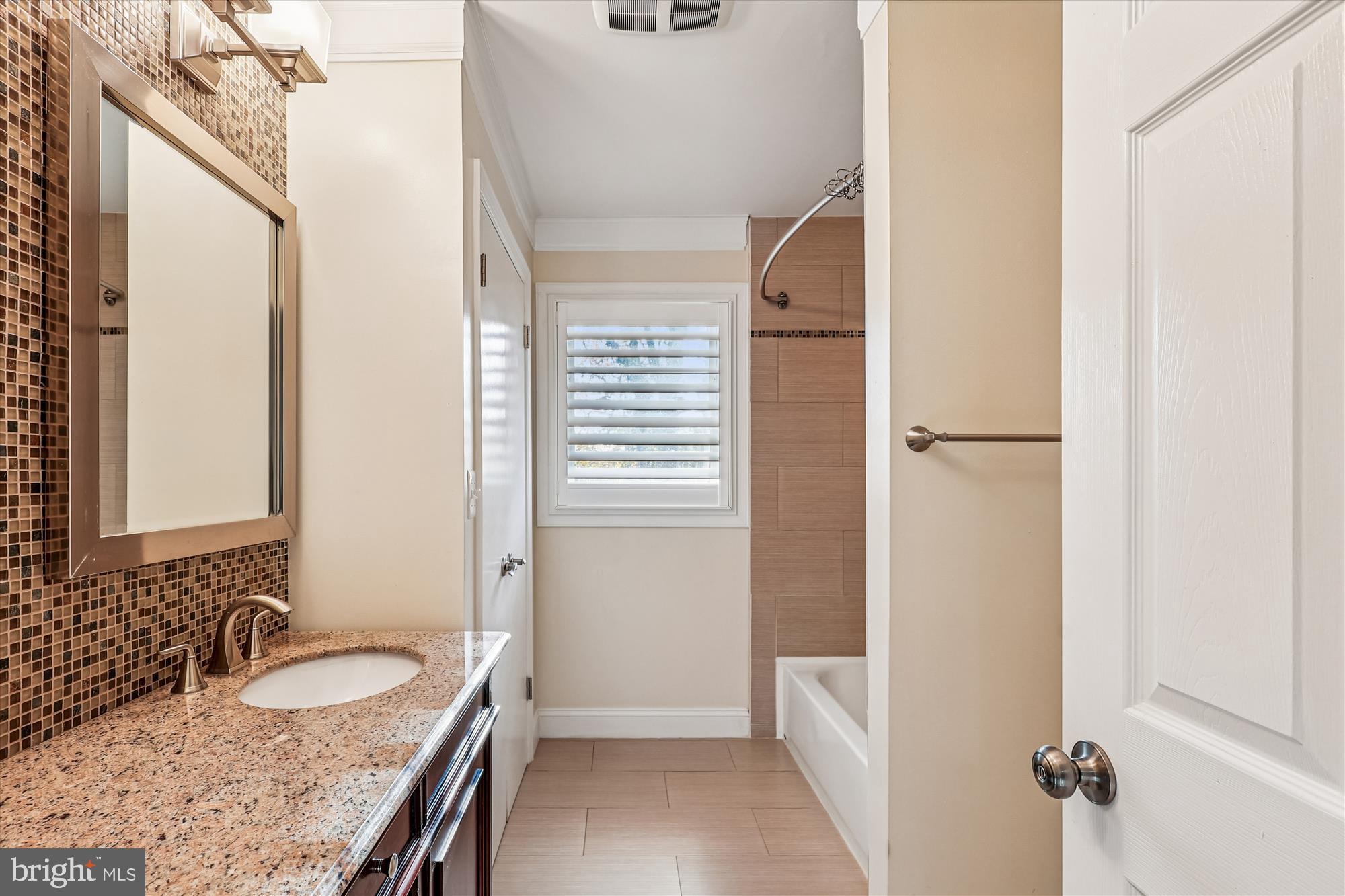 1506 Widows Mite Road Edgewater, MD 21037 - Photo 44 of 66 a bathroom with a granite countertop sink and a mirror