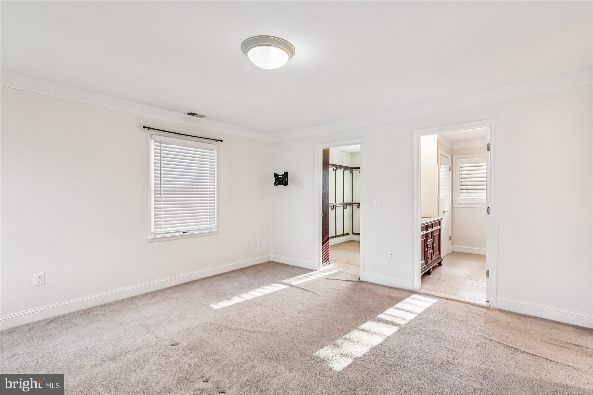 1506 Widows Mite Road Edgewater, MD 21037 - Photo 48 of 66 an empty room with windows and closet