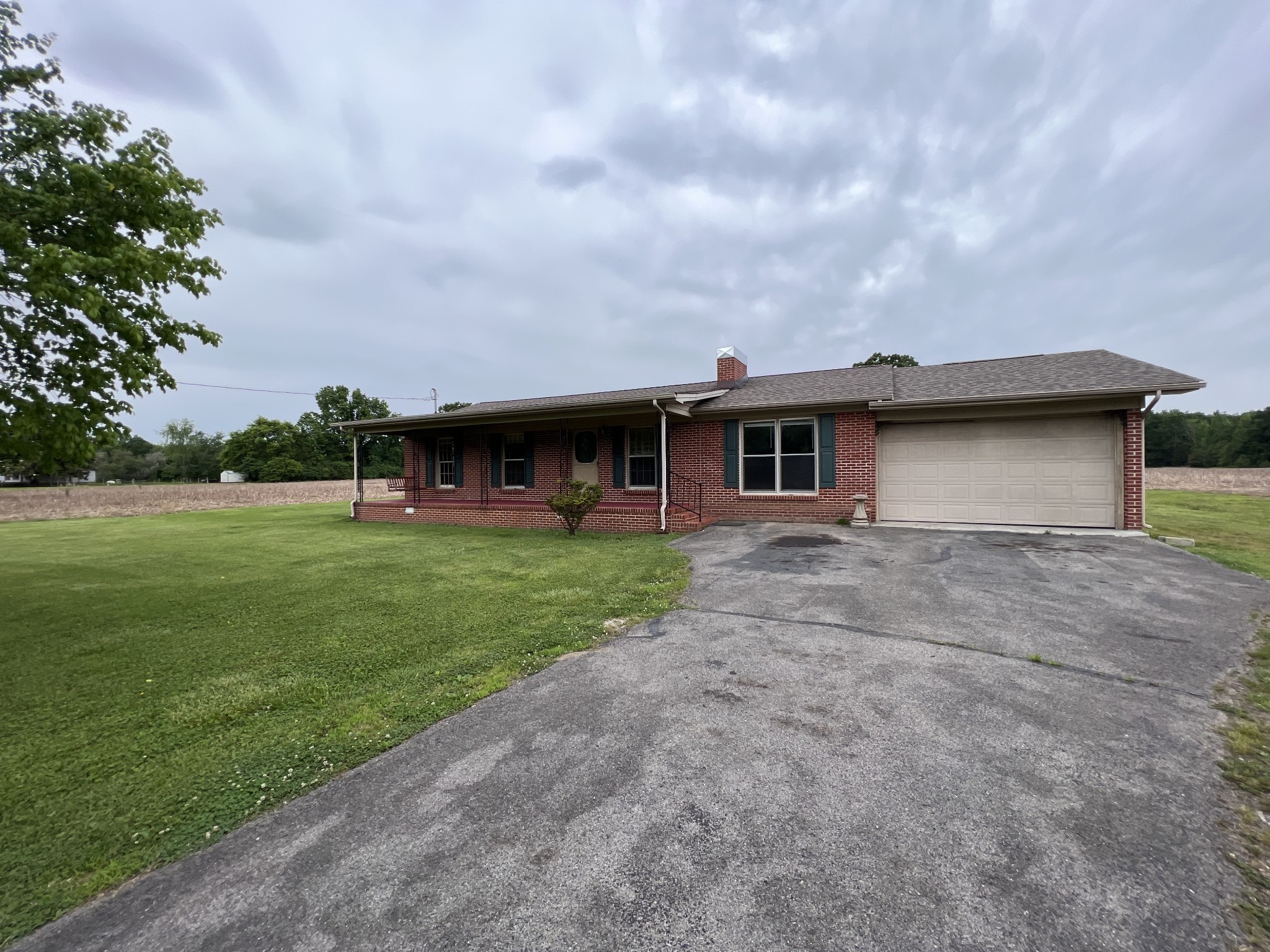 a view of a house with a backyard