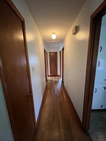 a view of gallery with wooden floor