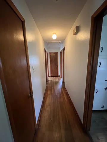 a view of gallery with wooden floor