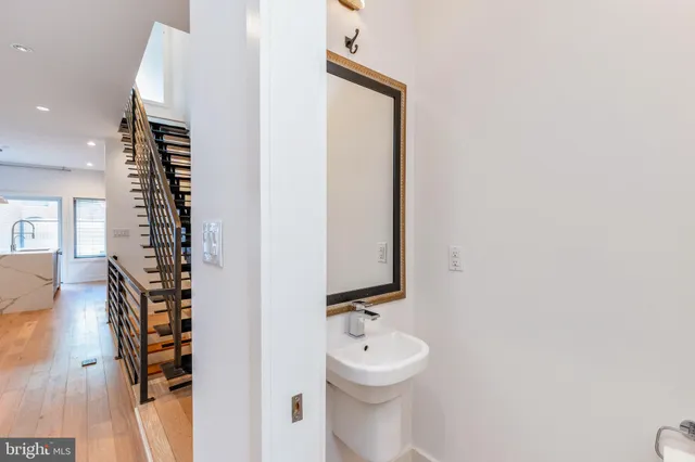 a kitchen with stainless steel appliances a sink a stove and a refrigerator