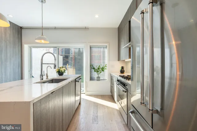 a building outdoor space with patio furniture and potted plants