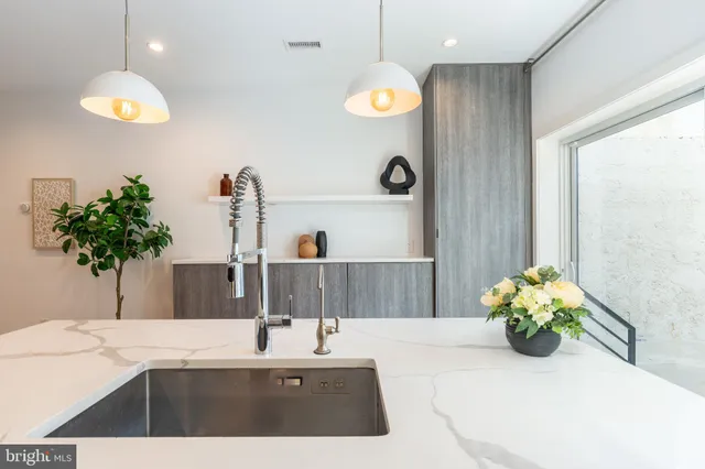 a living room with couches and a flat screen tv