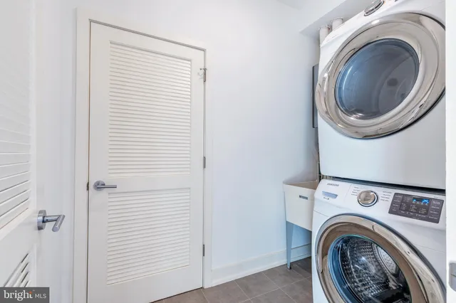 a living room with a window and furniture