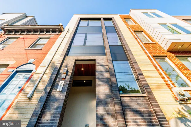 a dining room with furniture window and wooden floor