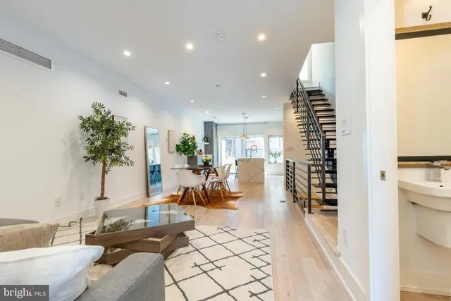 a kitchen with a refrigerator and a sink