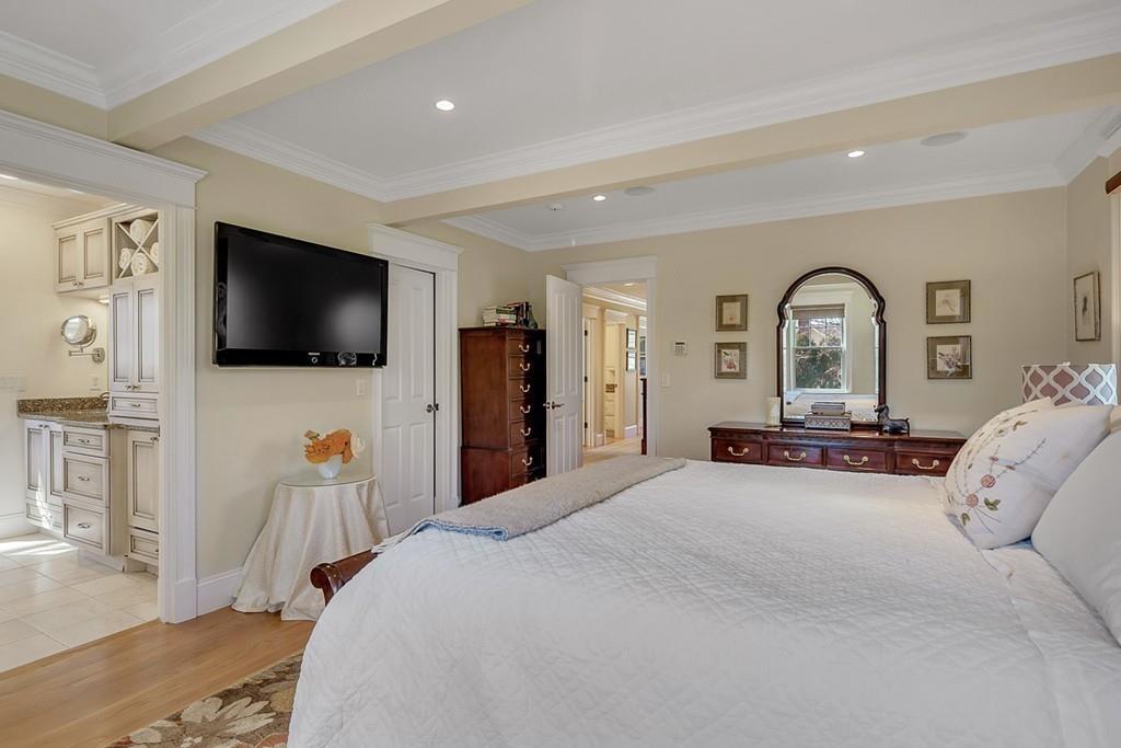 33 Everett Street Concord, MA 01742 - Photo 21 of 42 a bedroom with a bed and a flat screen tv