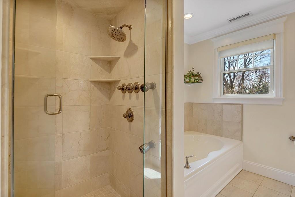 33 Everett Street Concord, MA 01742 - Photo 22 of 42 a bathroom with a bath tub with a shower