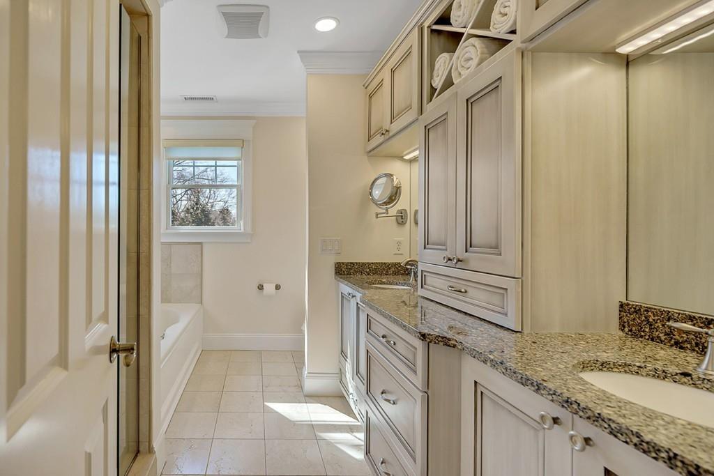 33 Everett Street Concord, MA 01742 - Photo 23 of 42 a spacious bathroom with a granite countertop sink mirror and a
