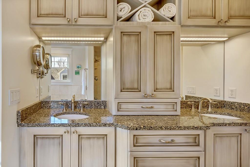 33 Everett Street Concord, MA 01742 - Photo 24 of 42 a bathroom with a granite countertop sink and a mirror