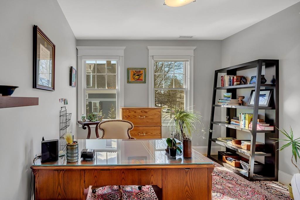 33 Everett Street Concord, MA 01742 - Photo 26 of 42 a living room with furniture and a book shelf