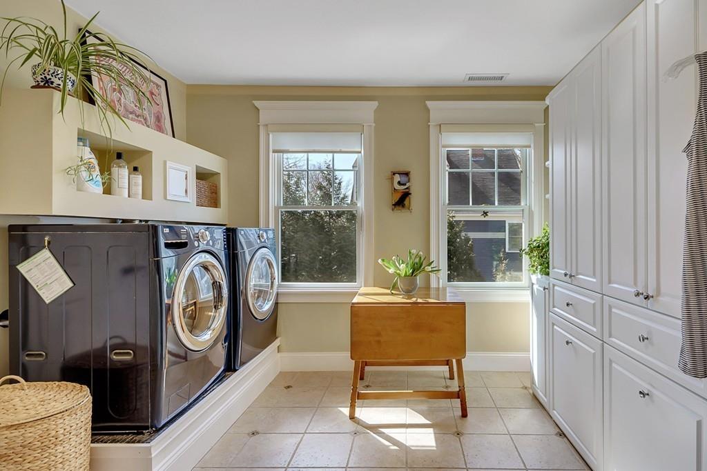 33 Everett Street Concord, MA 01742 - Photo 28 of 42 a living room with furniture a washer and dryer next to a window