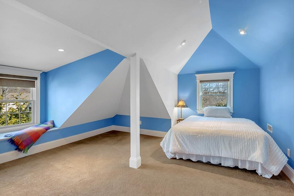 33 Everett Street Concord, MA 01742 - Photo 33 of 42 a bedroom with a bed and a potted plant