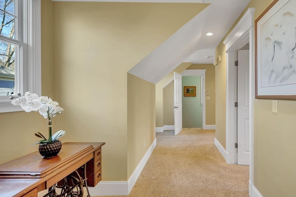 33 Everett Street Concord, MA 01742 - Photo 38 of 42 a view of a hallway with furniture and wooden floor