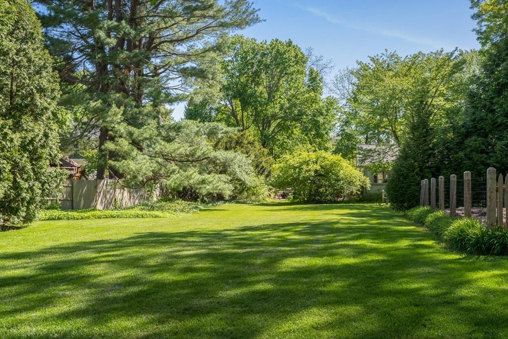 33 Everett Street Concord, MA 01742 - Photo 41 of 42 a big yard with trees in the background