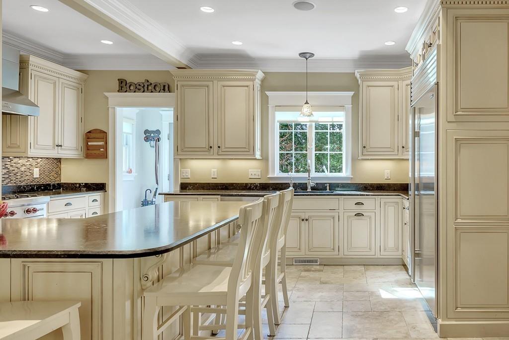 33 Everett Street Concord, MA 01742 - Photo 6 of 42 a kitchen with counter top space cabinets and stainless steel appliances