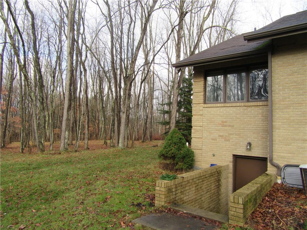 414 Klein Road Rochester, PA 15074 - Photo 35 of 37 a backyard of a house with large trees