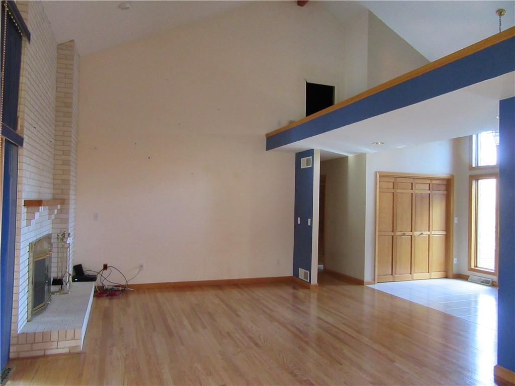 414 Klein Road Rochester, PA 15074 - Photo 7 of 37 a view of an empty room with wooden floor and a window