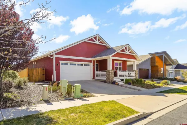 a front view of a house with yard patio and fire pit