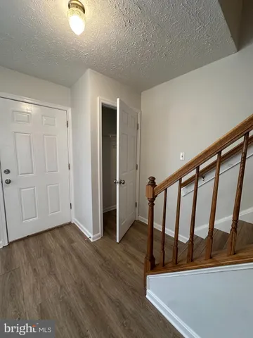 a view of entryway with wooden floor