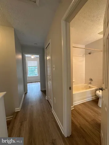 a bathroom with a bathtub and a toilet