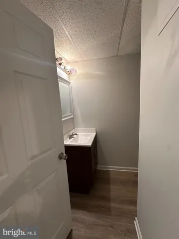 a white toilet sitting next to a shower