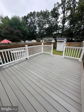 a view of a house with a yard and garage