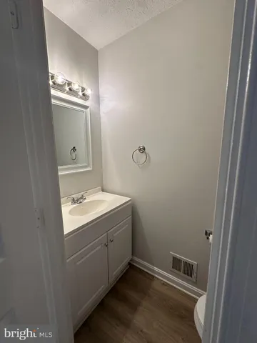a room with a sink cabinets and utility room