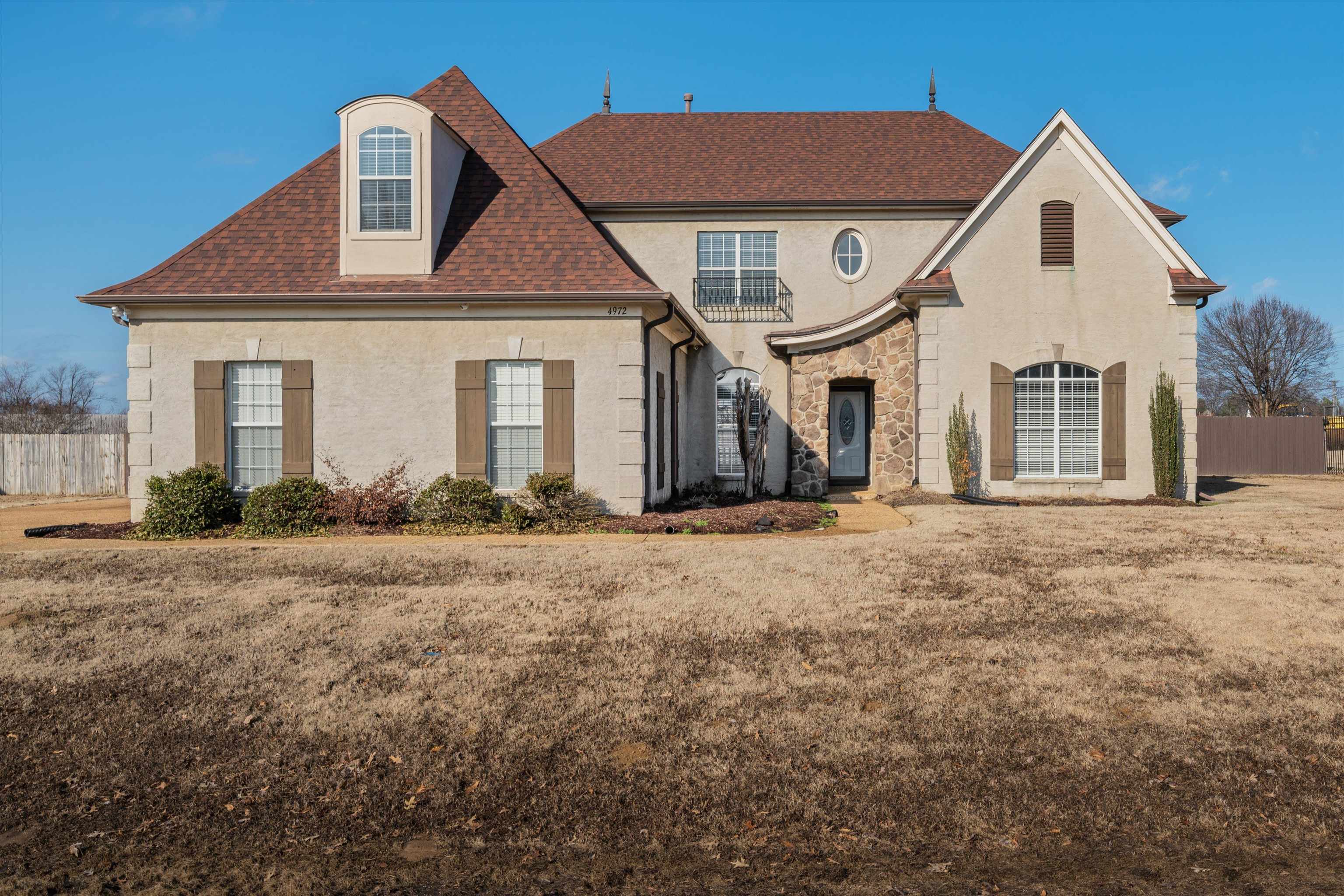 4972 Pleasant Ridge Drive Olive Branch, MS 38654 - Photo 1 of 24 a front view of a house with a yard