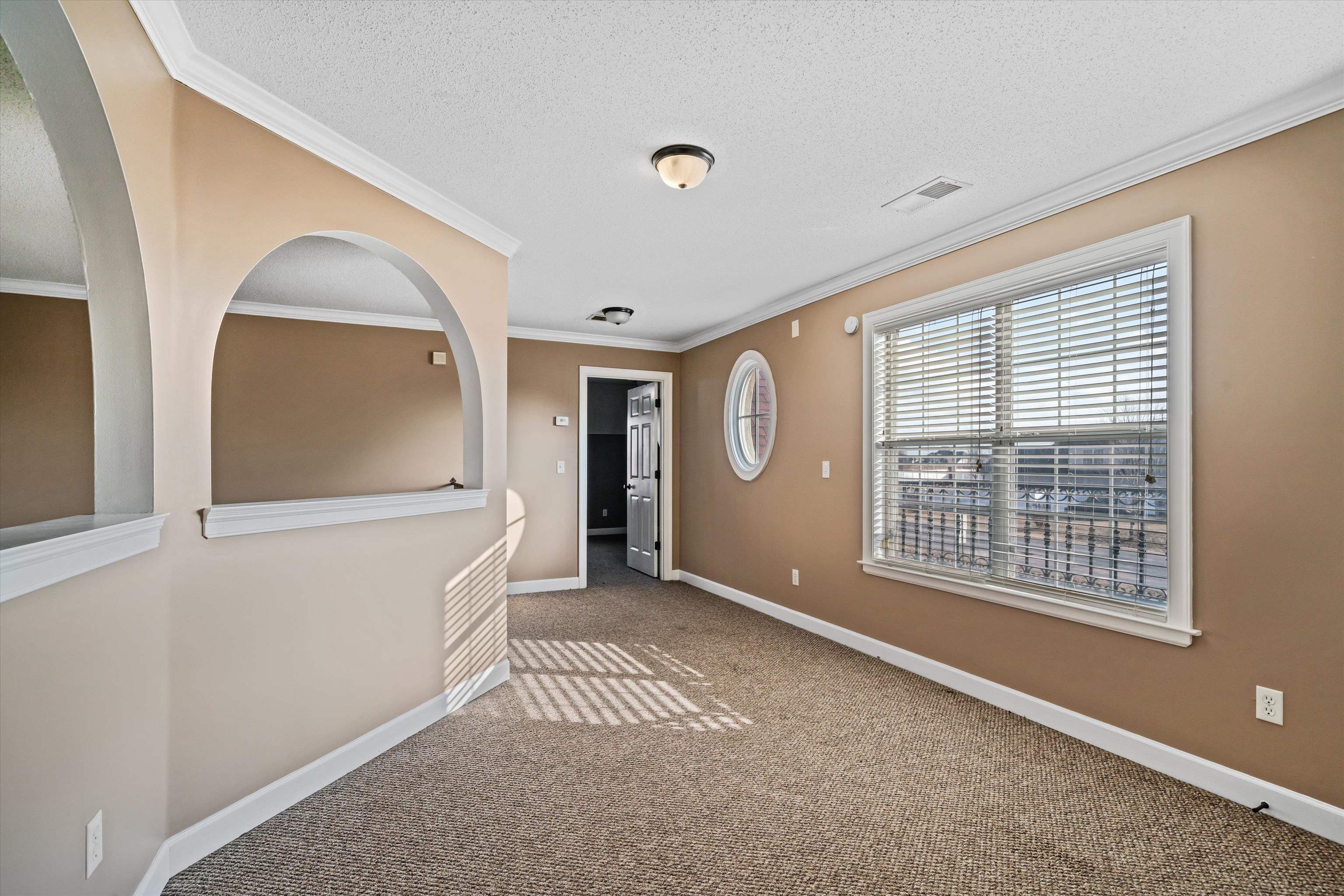 4972 Pleasant Ridge Drive Olive Branch, MS 38654 - Photo 21 of 24 an empty room with windows
