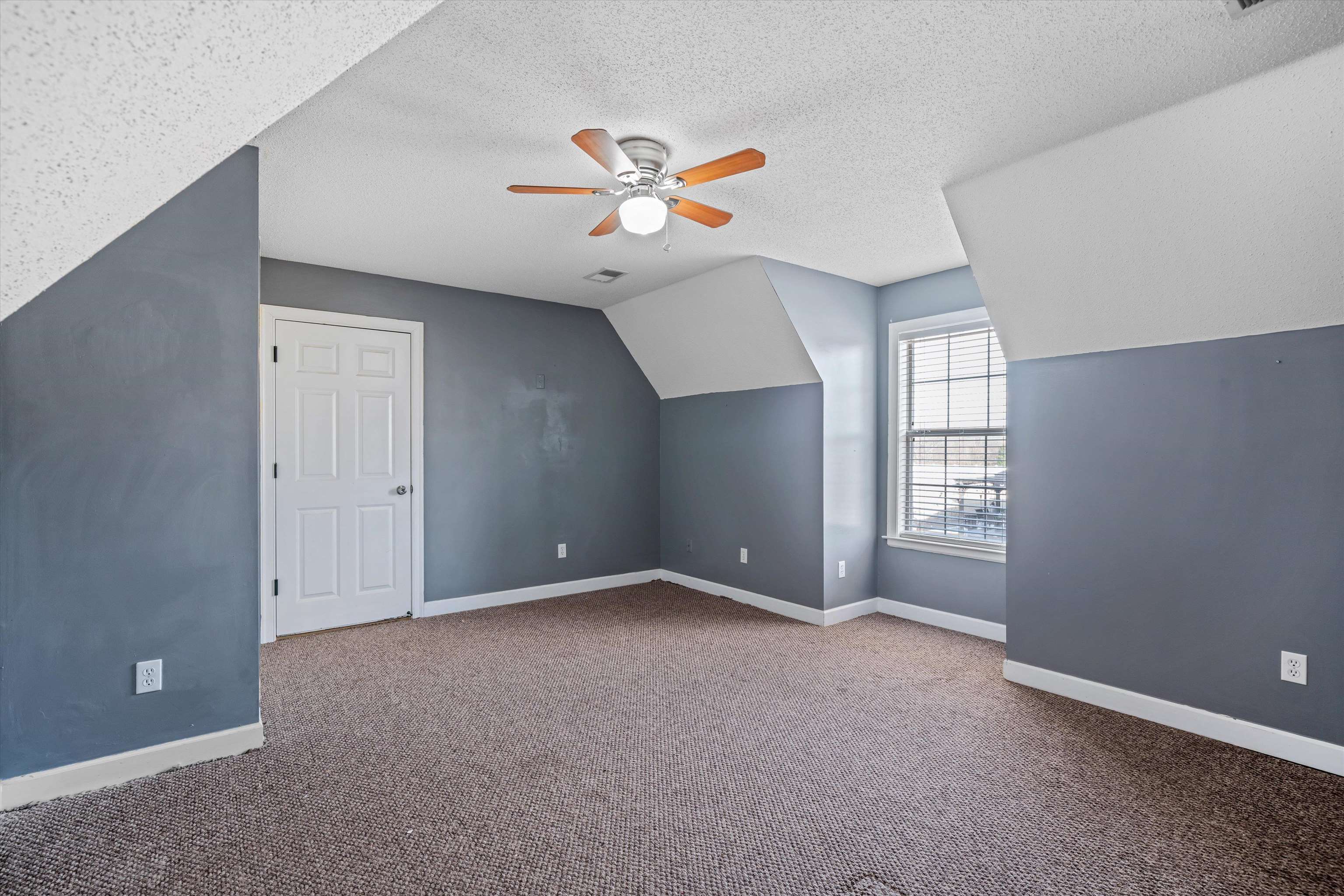 4972 Pleasant Ridge Drive Olive Branch, MS 38654 - Photo 23 of 24 an empty room with windows and fan