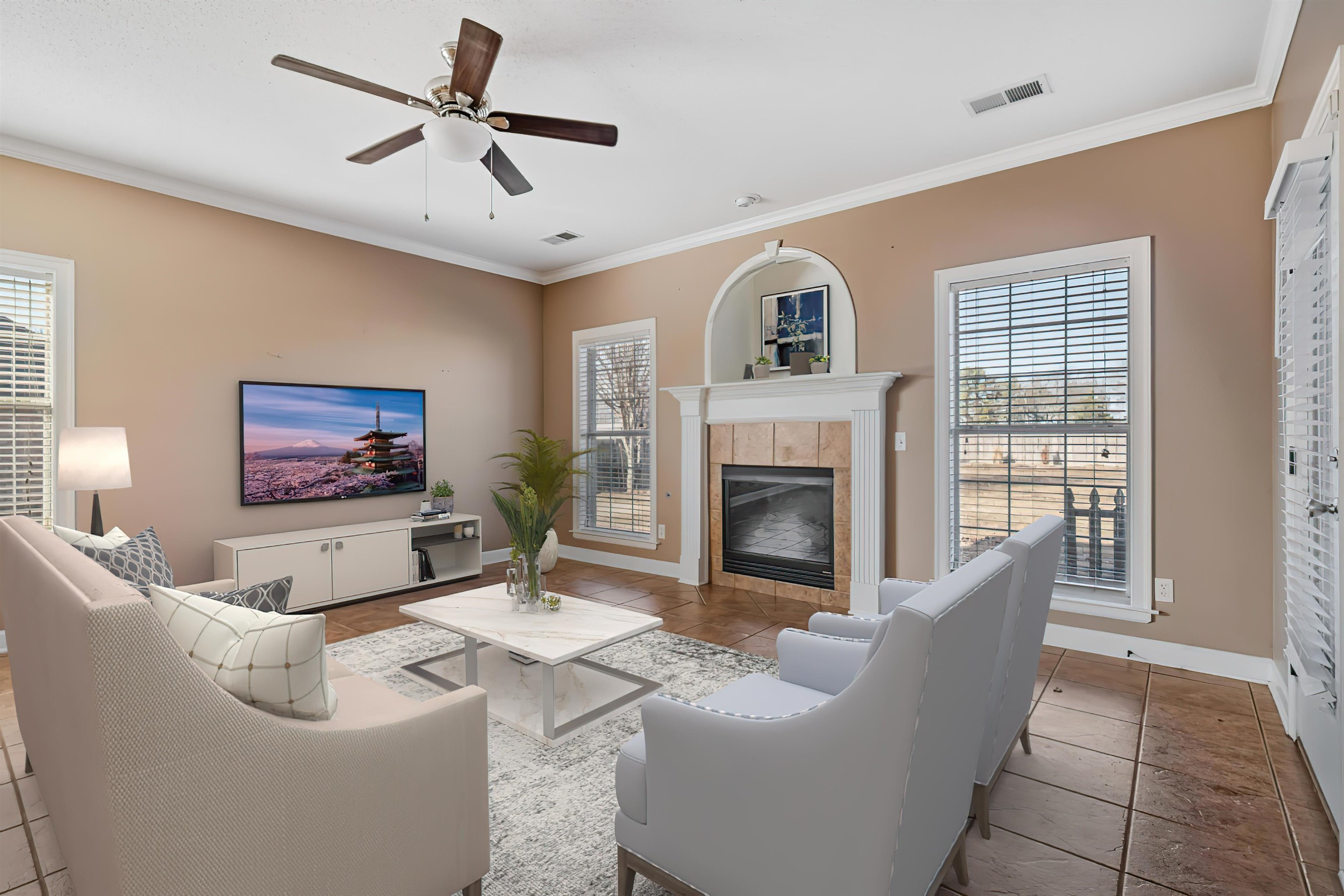 4972 Pleasant Ridge Drive Olive Branch, MS 38654 - Photo 3 of 24 a living room with furniture a fireplace and a flat screen tv
