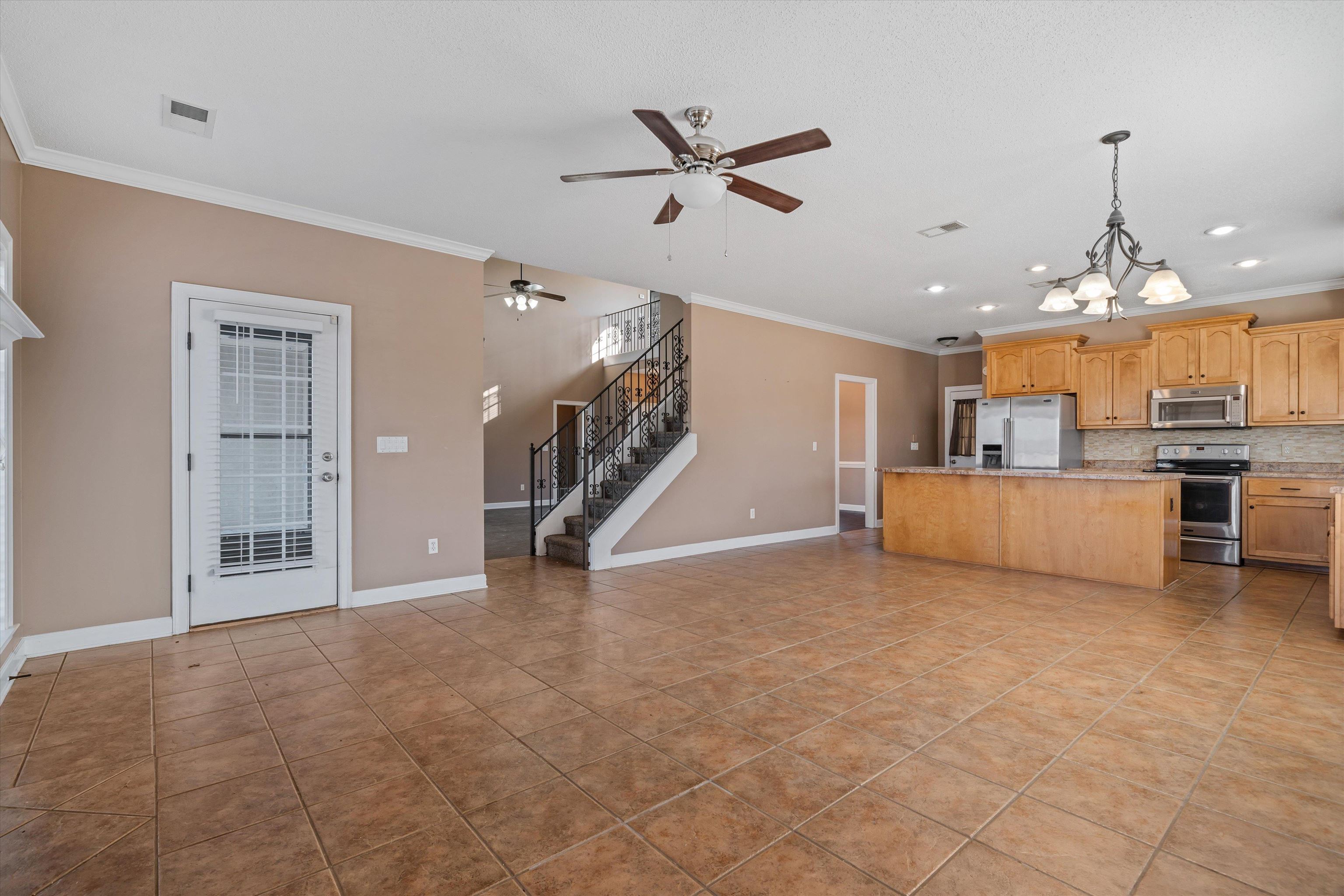 4972 Pleasant Ridge Drive Olive Branch, MS 38654 - Photo 10 of 24 a view of a livingroom with furniture and a ceiling fan