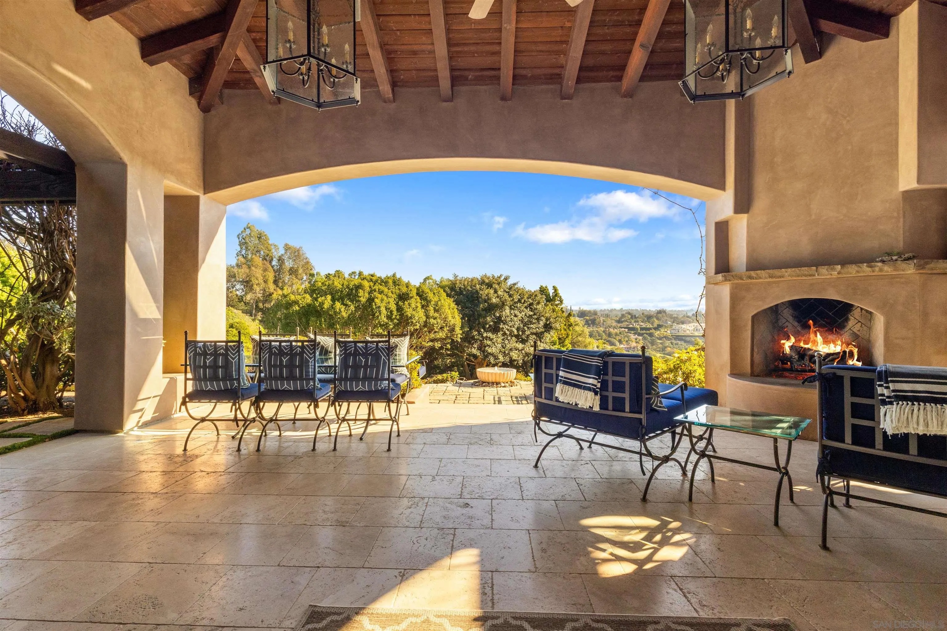 6871 Las Colinas Rancho Santa Fe, CA 92067 - Photo 17 of 60 a view of a patio with dining table and chairs with wooden floor and fence