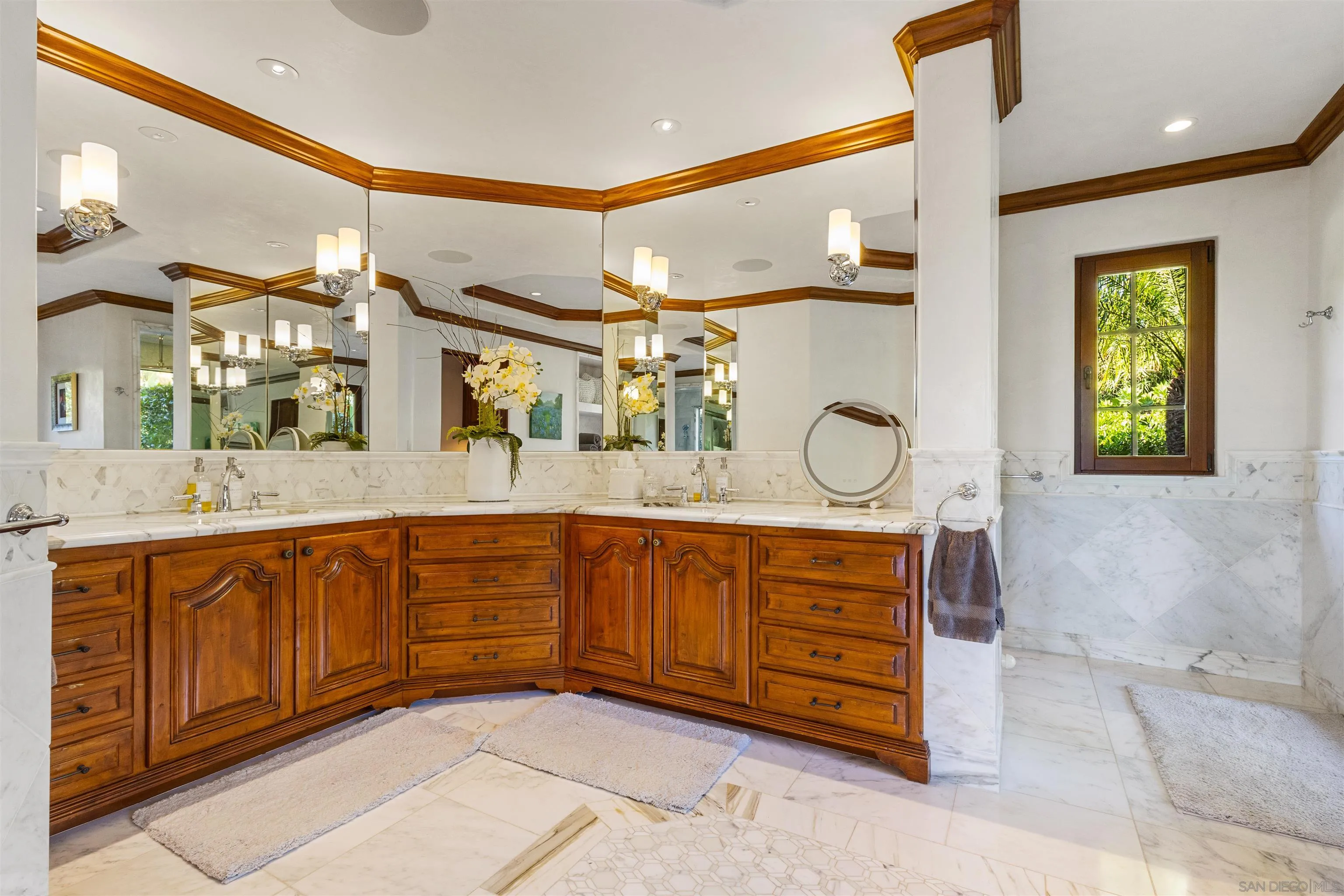 6871 Las Colinas Rancho Santa Fe, CA 92067 - Photo 37 of 60 a spacious bathroom with a granite countertop sink a mirror and a vanity