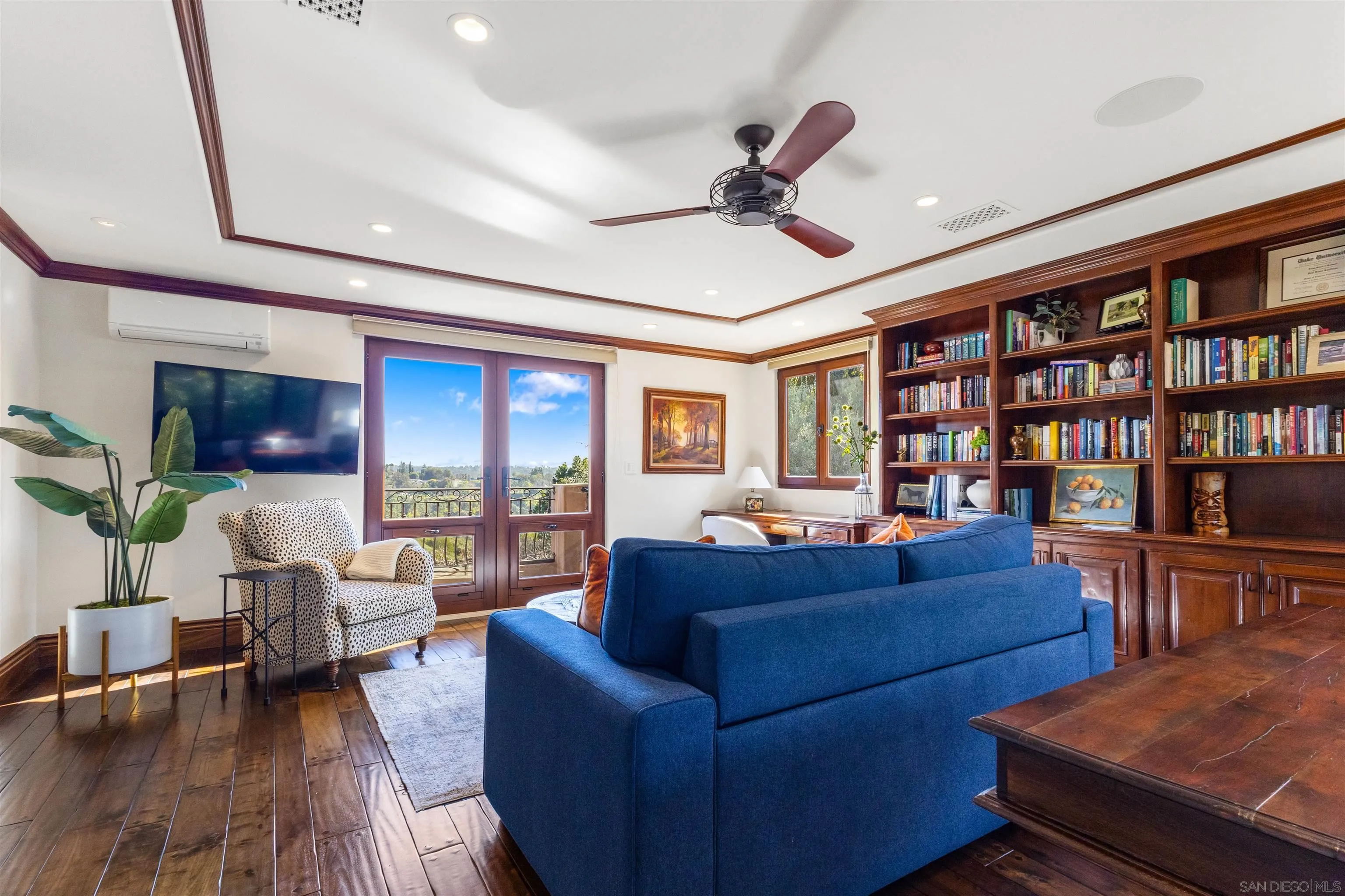 6871 Las Colinas Rancho Santa Fe, CA 92067 - Photo 42 of 60 a living room with furniture or couch and a bookshelf