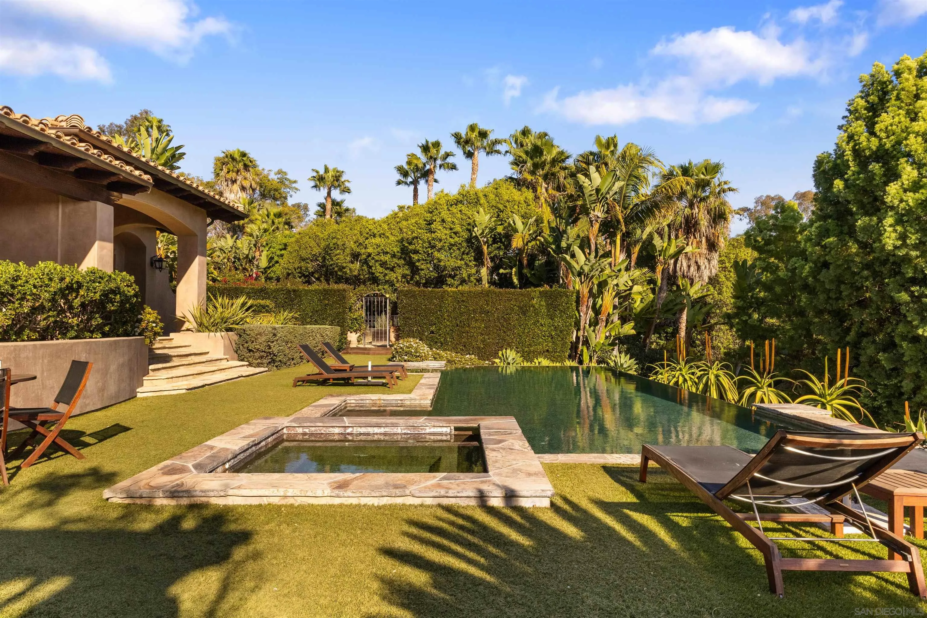 6871 Las Colinas Rancho Santa Fe, CA 92067 - Photo 52 of 60 a view of a swimming pool with an outdoor seating and a yard