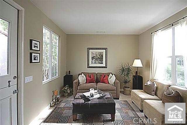 95 Windchime Irvine, CA 92603 - Photo 3 of 8 a living room with furniture and a window