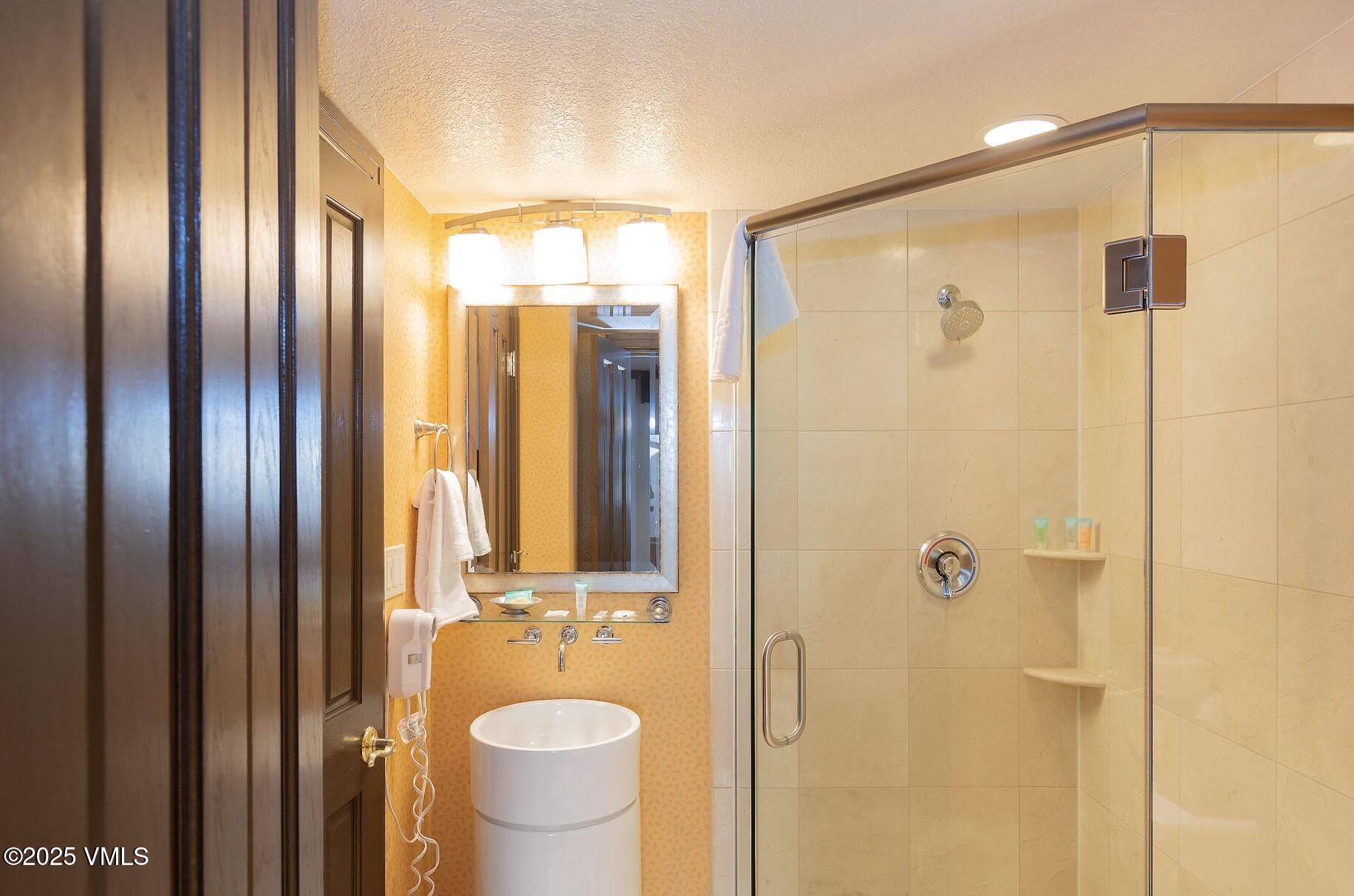 210 Offerson Road, Unit R315 WEEK 14 Beaver Creek, CO 81620 - Photo 11 of 31 a bathroom with a shower and a sink