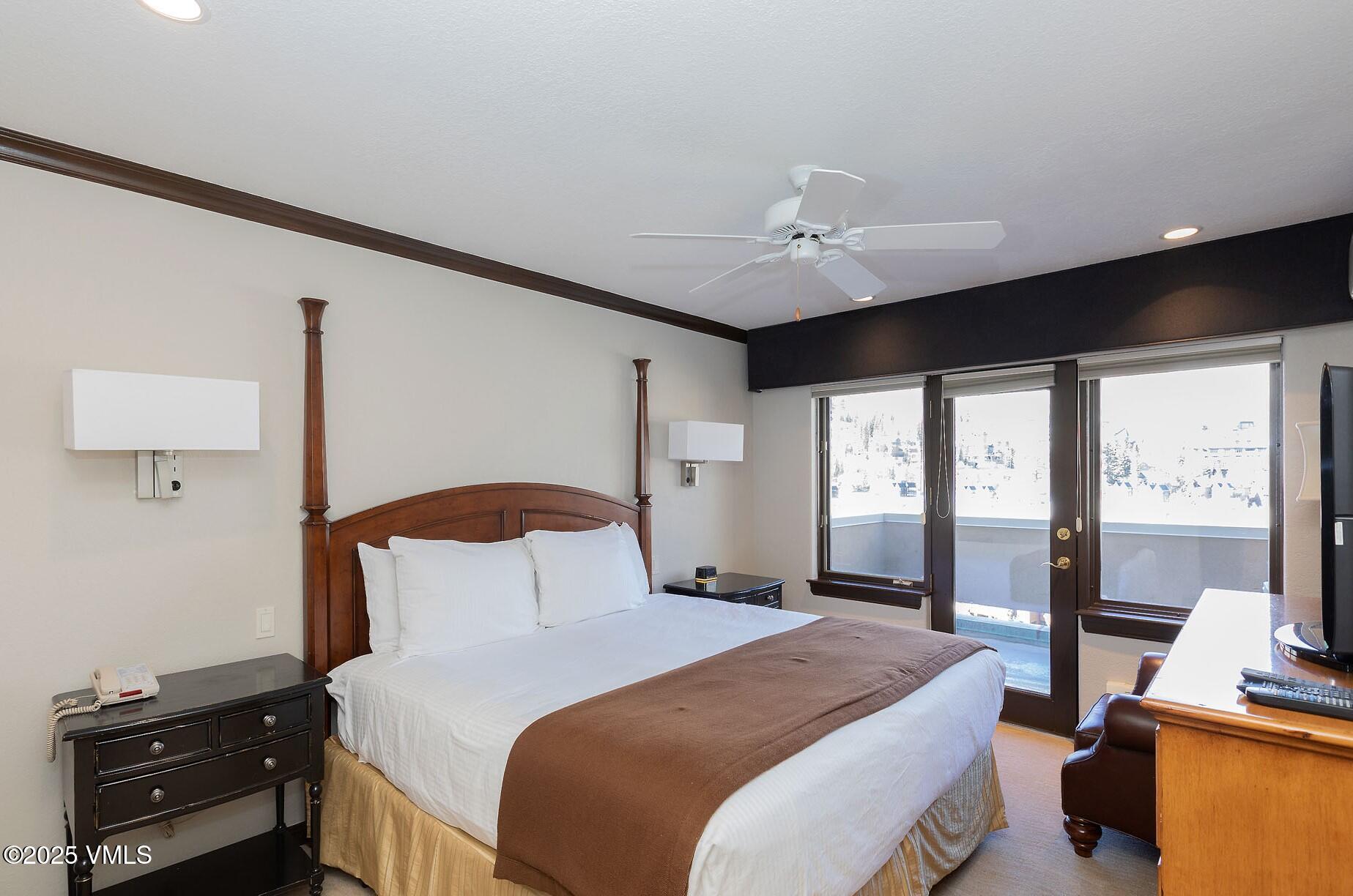 210 Offerson Road, Unit R315 WEEK 14 Beaver Creek, CO 81620 - Photo 20 of 31 a bedroom with a bed and a ceiling fan