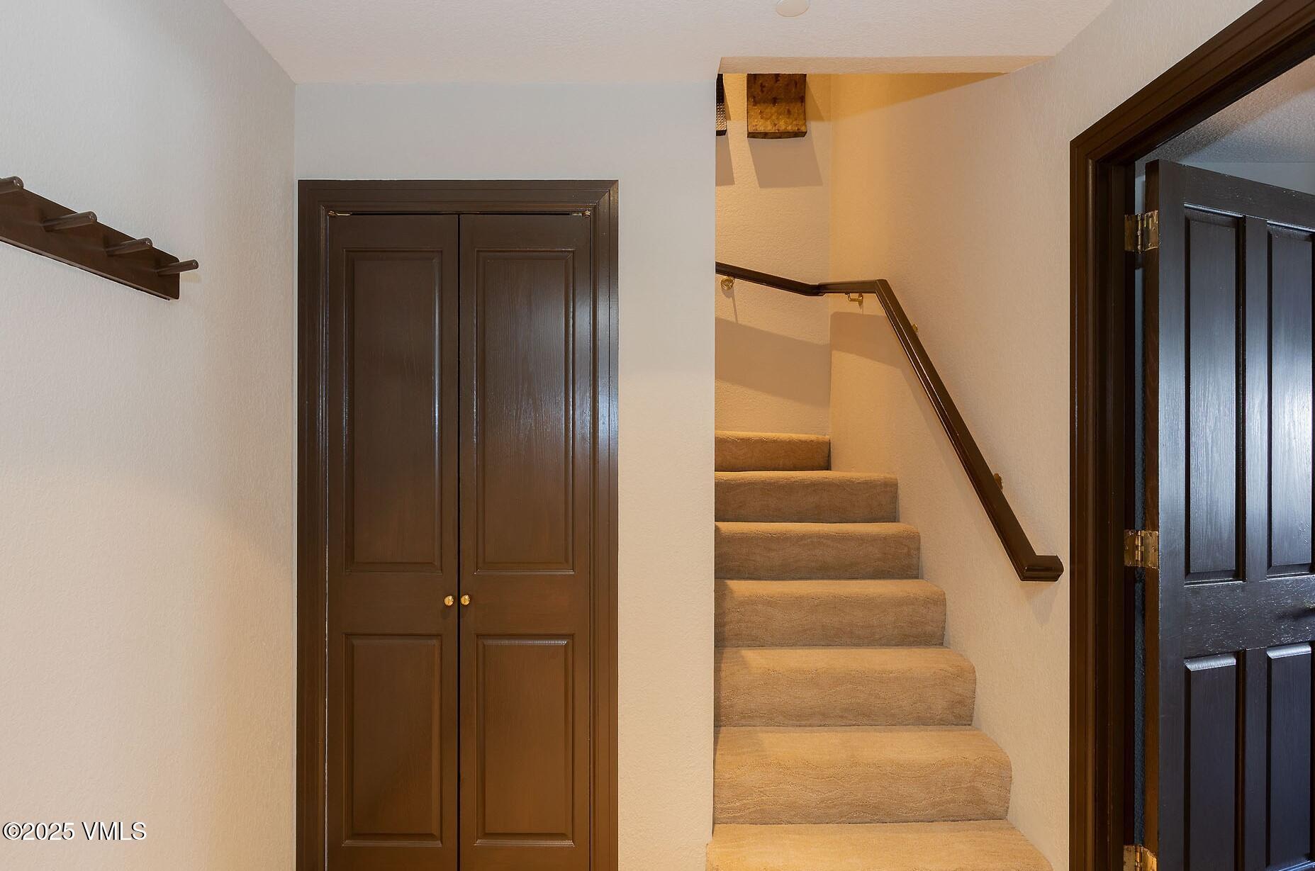 210 Offerson Road, Unit R315 WEEK 14 Beaver Creek, CO 81620 - Photo 23 of 31 a view of staircase with white walls and a window