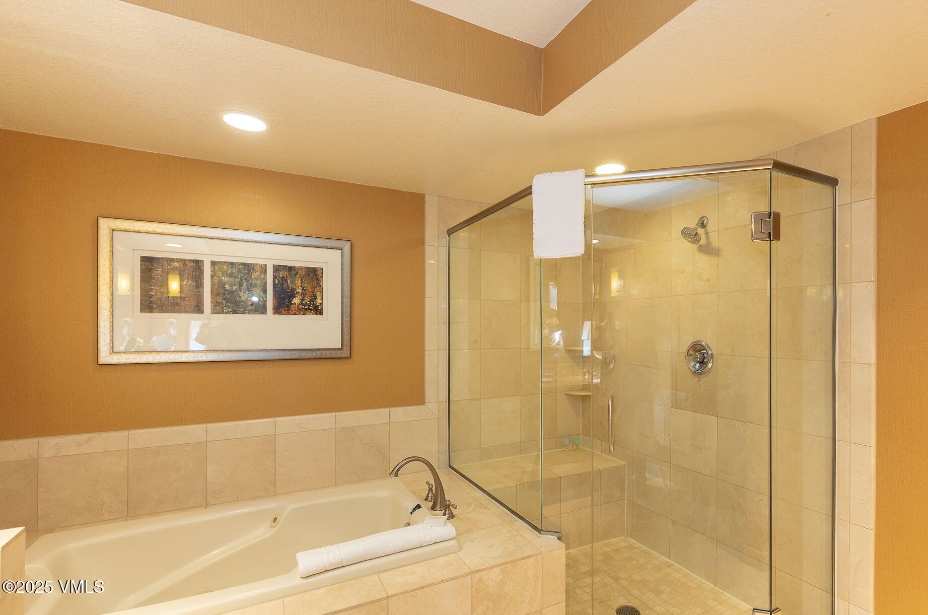 210 Offerson Road, Unit R315 WEEK 14 Beaver Creek, CO 81620 - Photo 28 of 31 a bathroom with a bathtub and a shower