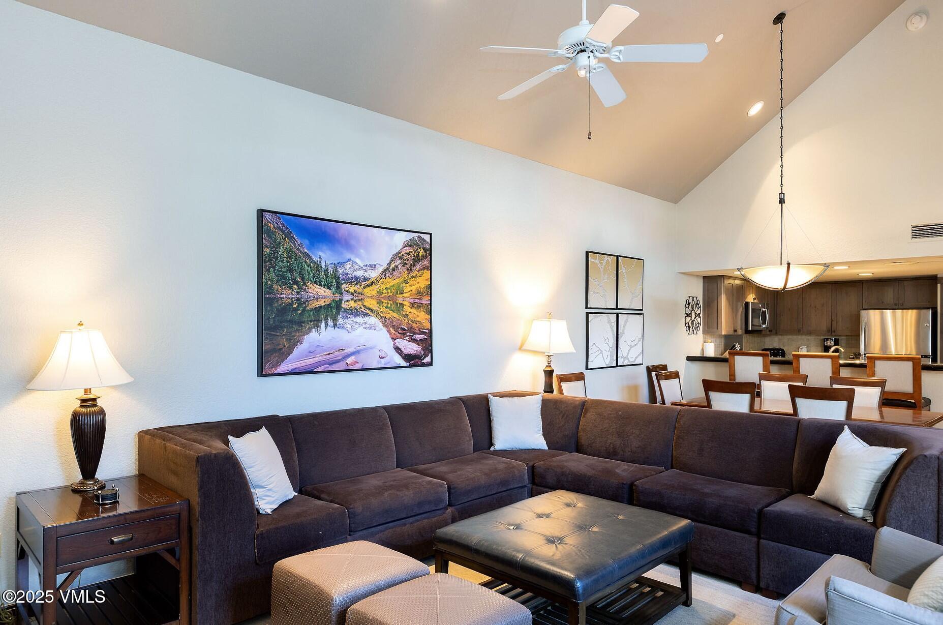 210 Offerson Road, Unit R315 WEEK 14 Beaver Creek, CO 81620 - Photo 6 of 31 a living room with furniture a fireplace and a chandelier