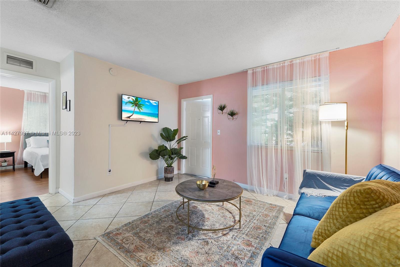 828 Southwest 2nd Street Miami, FL 33130 - Photo 4 of 13 a living room with furniture and wooden floor