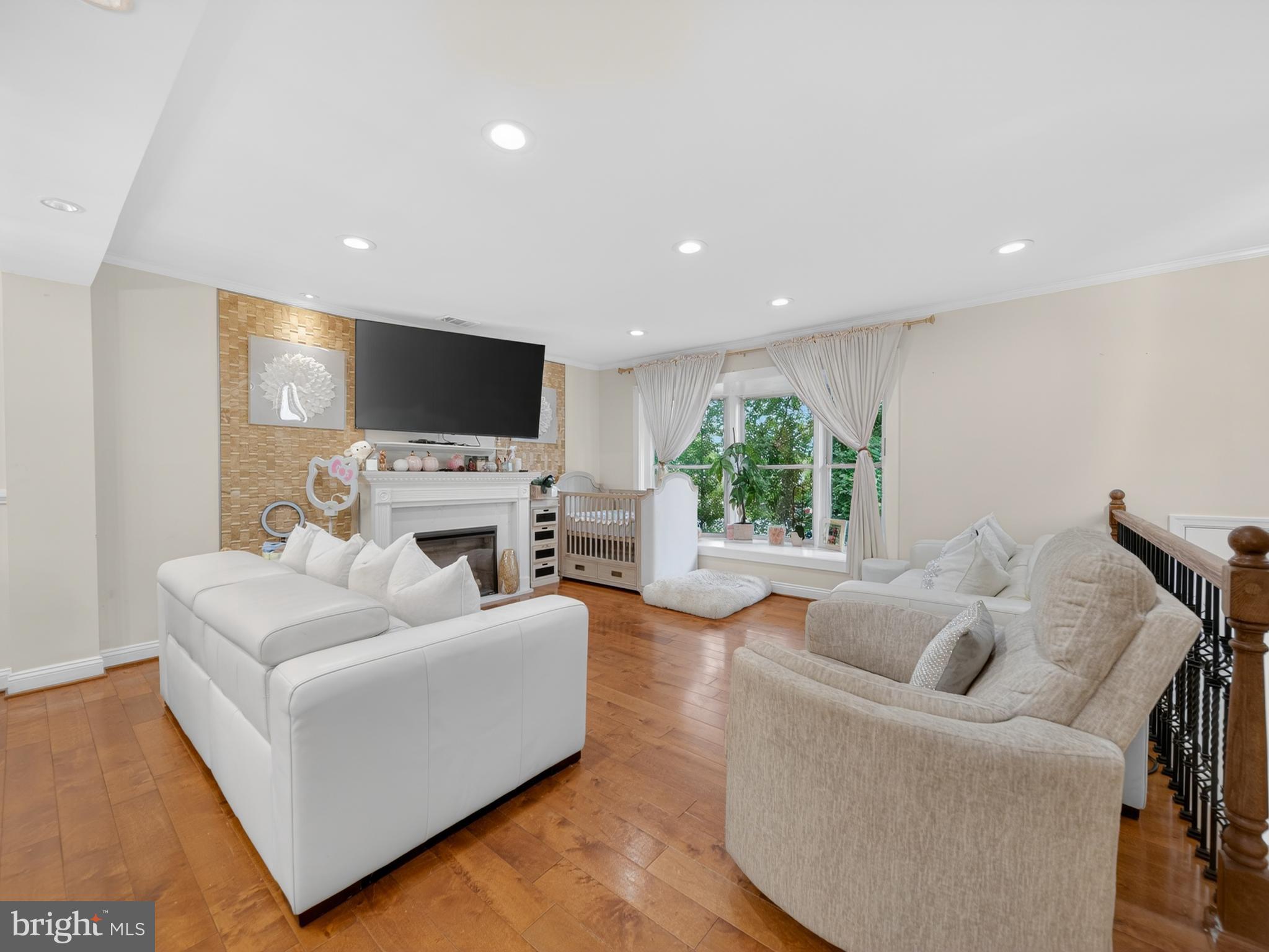 13427 Delaney Road Woodbridge, VA 22193 - Photo 25 of 57 a living room with furniture a flat screen tv and a large window