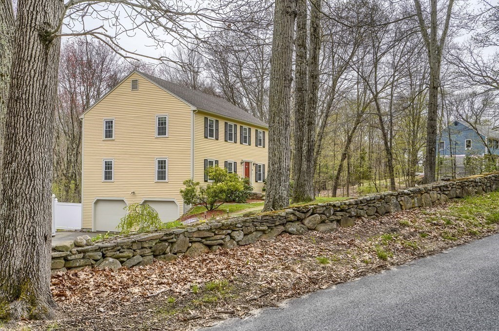 44 Glendale Road Boxford, MA 01921 - Photo 2 of 42 a view of a white house next to a yard with a large tree