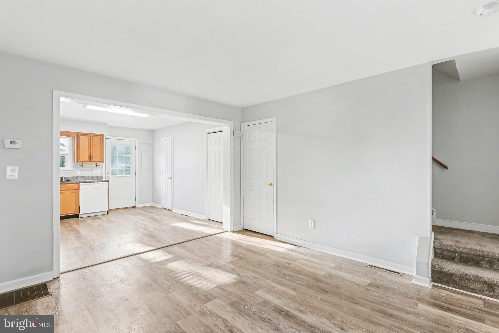 143 15th Street, Unit 3 New Cumberland, PA 17070 - Photo 4 of 10 a view of a kitchen with a sink and a stove top oven